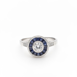 Anillo "ojo de perdiz" con Diamante central y Zafiros. - Imagen 1